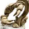 Abstract crab-claw sculpture holding small stone